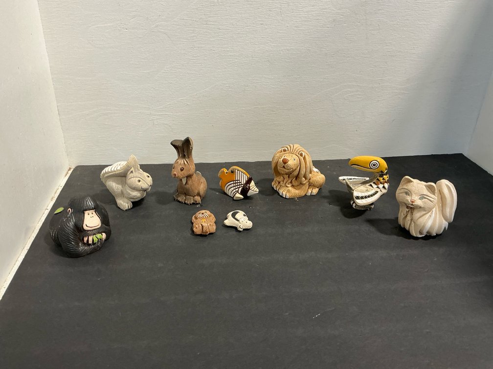 Carved ceramic animal figurines with color glaze