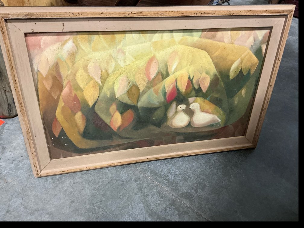 Framed painting of two white birds in foliage