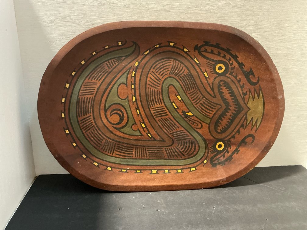 Carved wooden oval tray with painted serpent motif