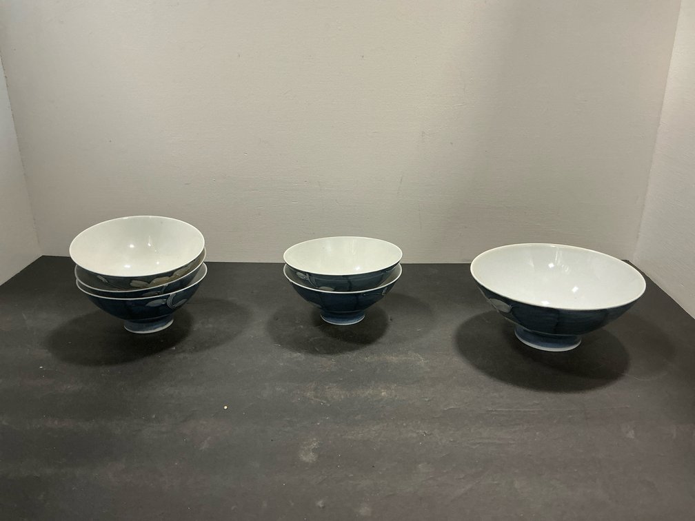 Set of blue and white ceramic footed bowls