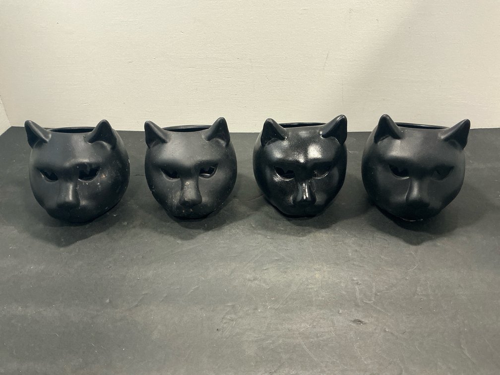 Set of black ceramic cat head vessels