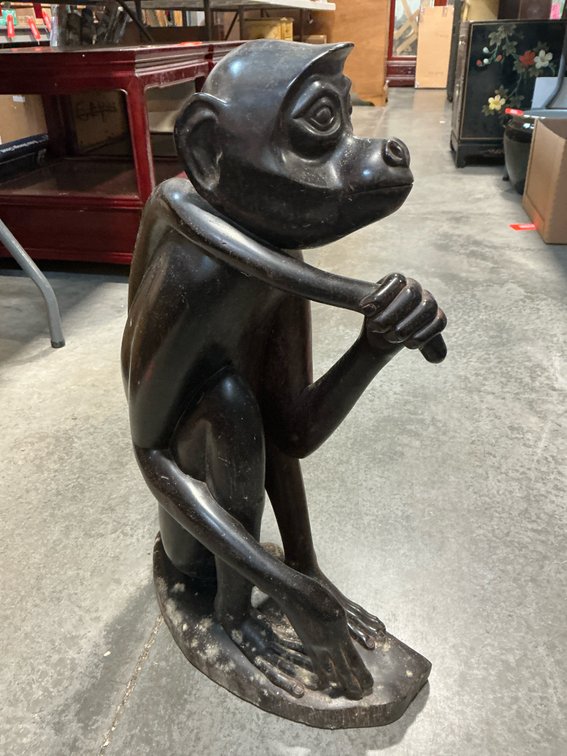 Carved dark wood seated monkey sculpture