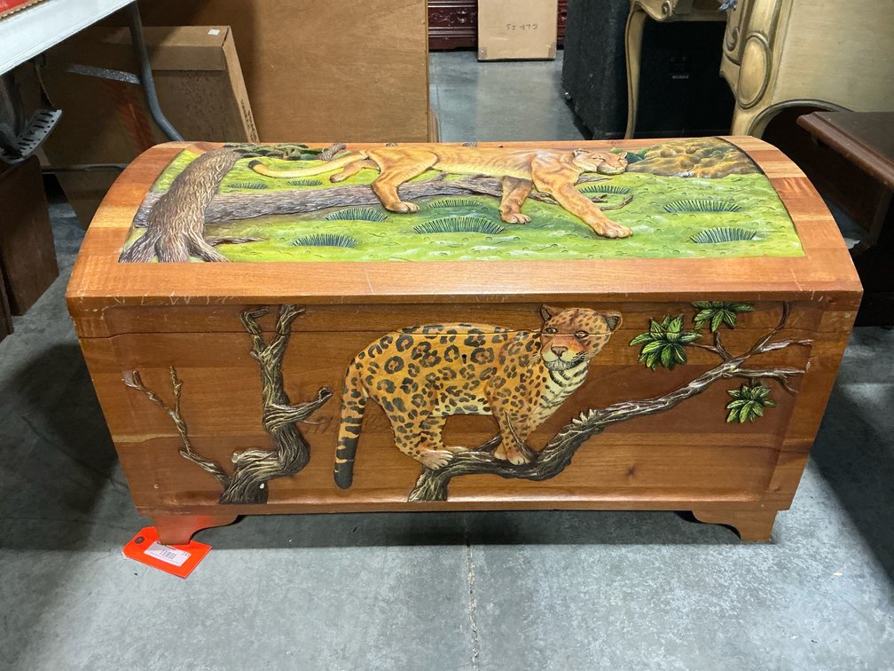 Carved wood arched-top chest with big cat reliefs