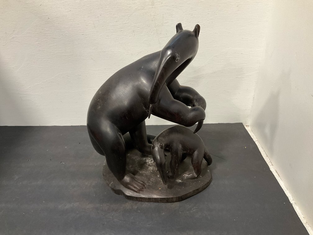 Carved dark wood adult & baby anteater sculpture