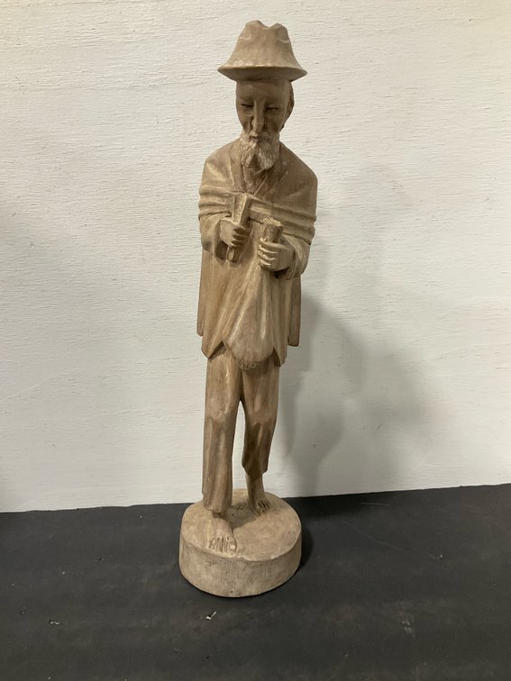 Carved wood figurine of bearded man with hat