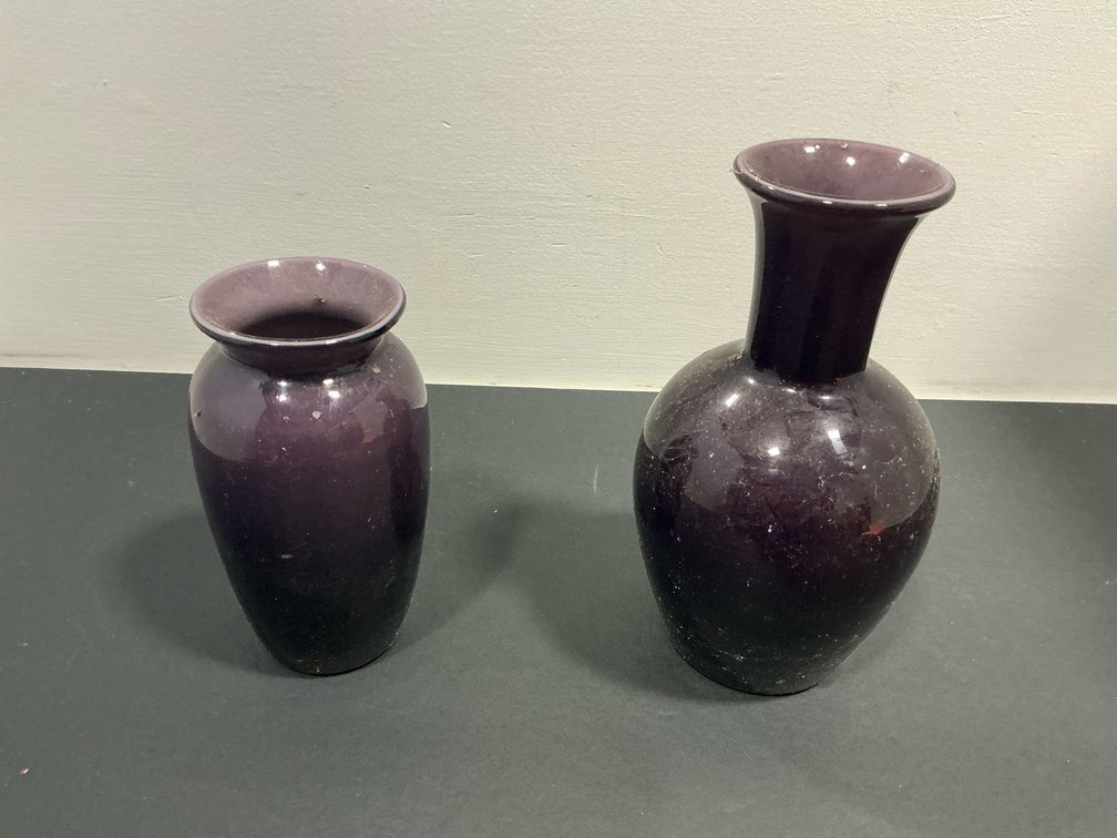 Grouping of dark purple vases with flared rims
