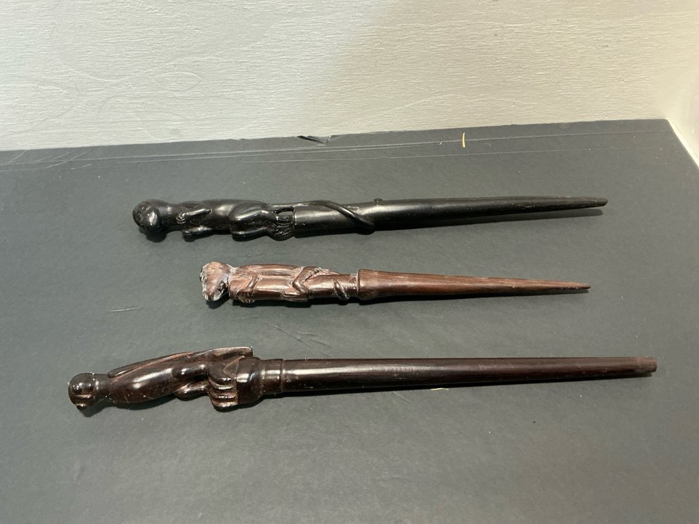 Grouping of carved wood figural sticks