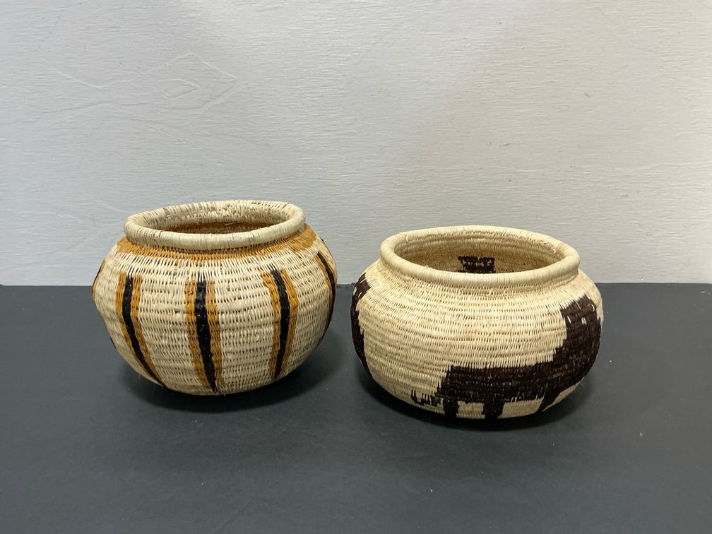 Coiled woven baskets with animal & geometric motifs