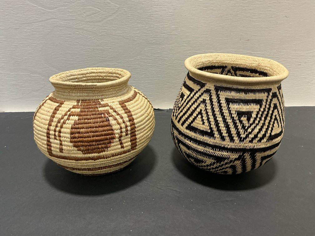 Pair of coiled woven baskets with flared rims