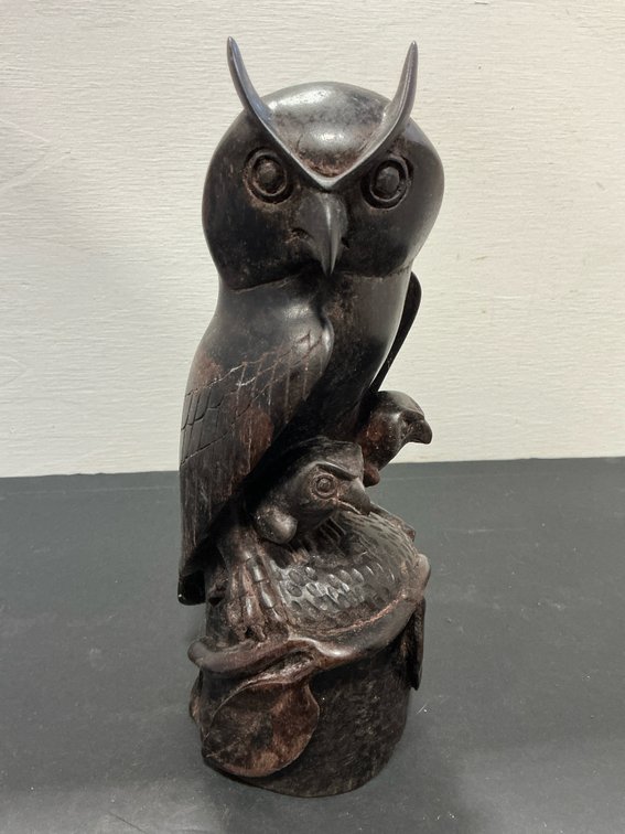 Carved wood horned owl sculpture with owlets