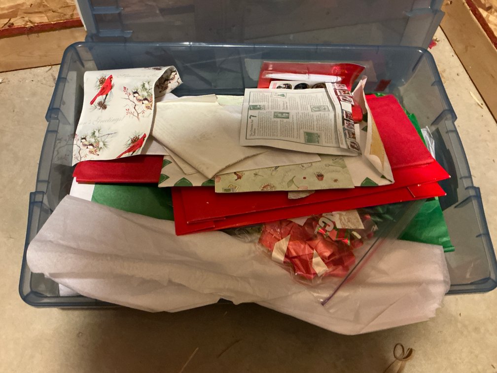 Holiday greeting cards & gift wrapping supplies in totes - Basement