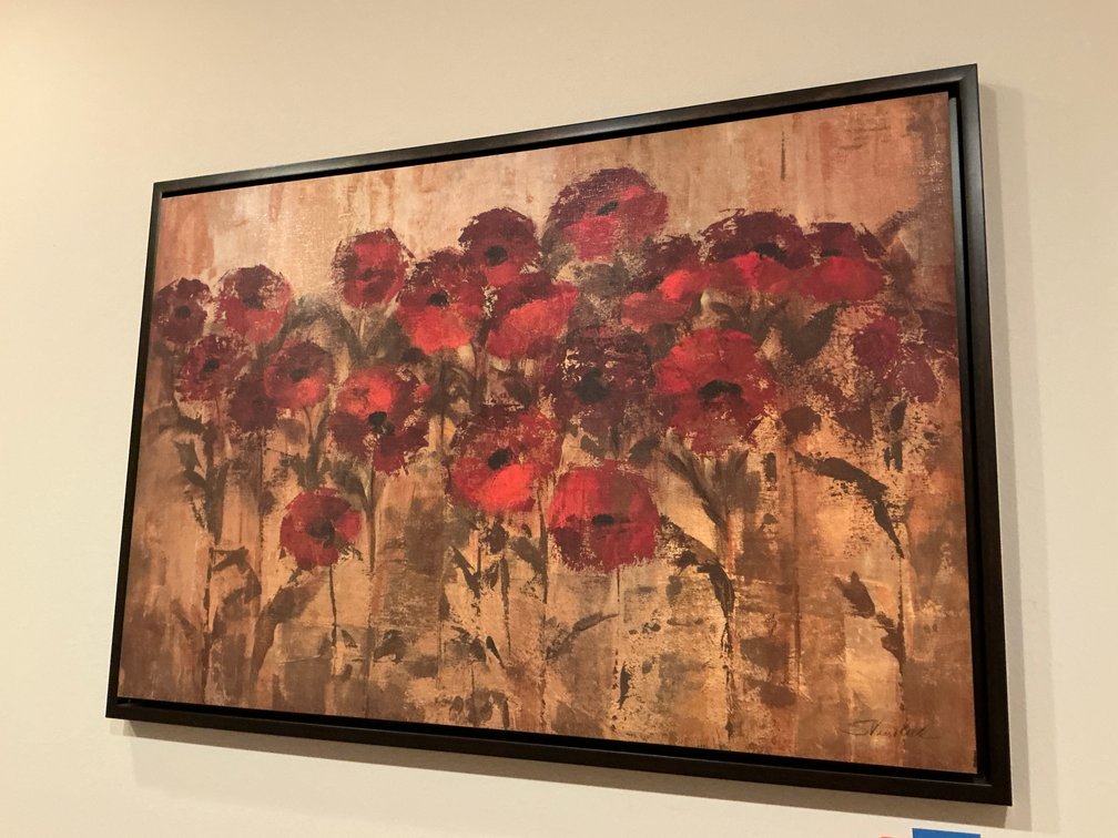 2 framed floral paintings in dark frames - Basement