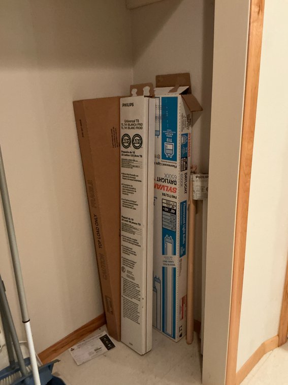 Grouping of winter boots, backpack, hangers & light bulbs - Basement