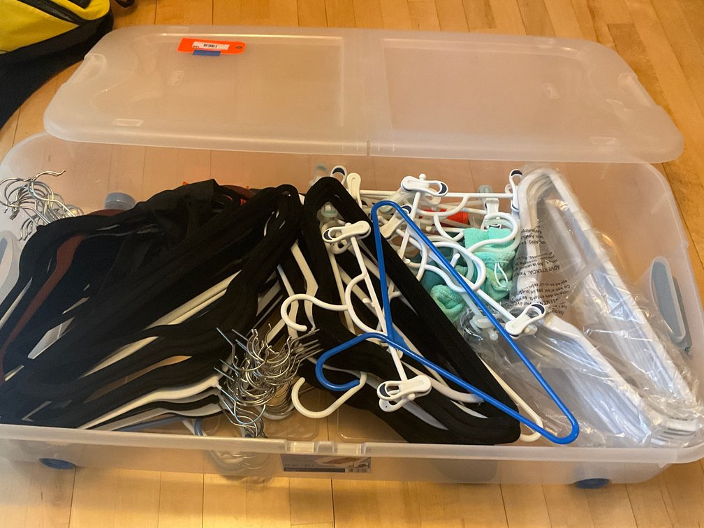 Rolling underbed storage tote with hangers & Space Bags - Dining Room Main Level