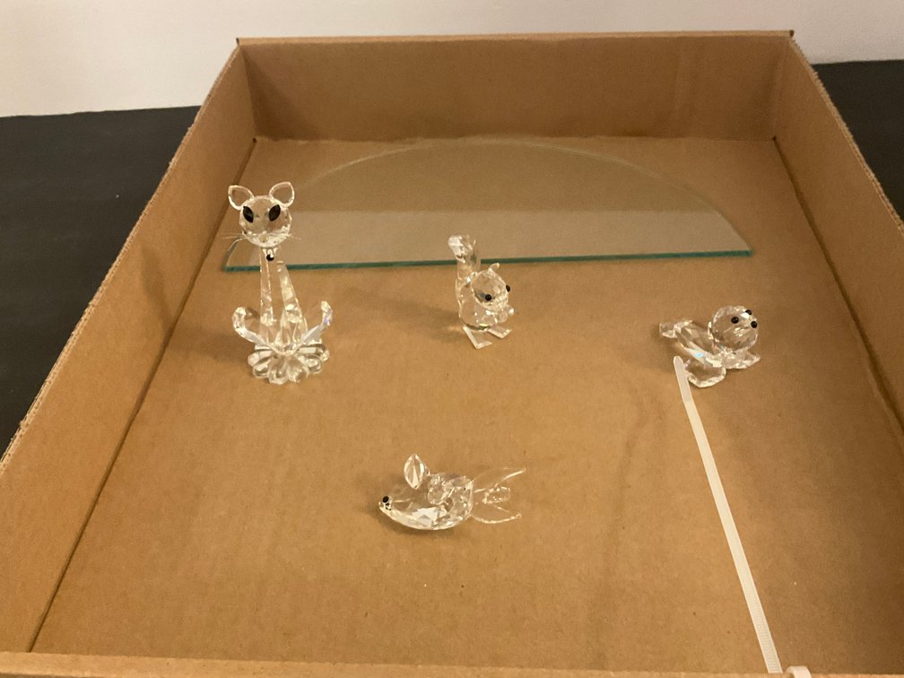 Clear faceted crystal animal figurines & glass shelf - Dining Room Main Level