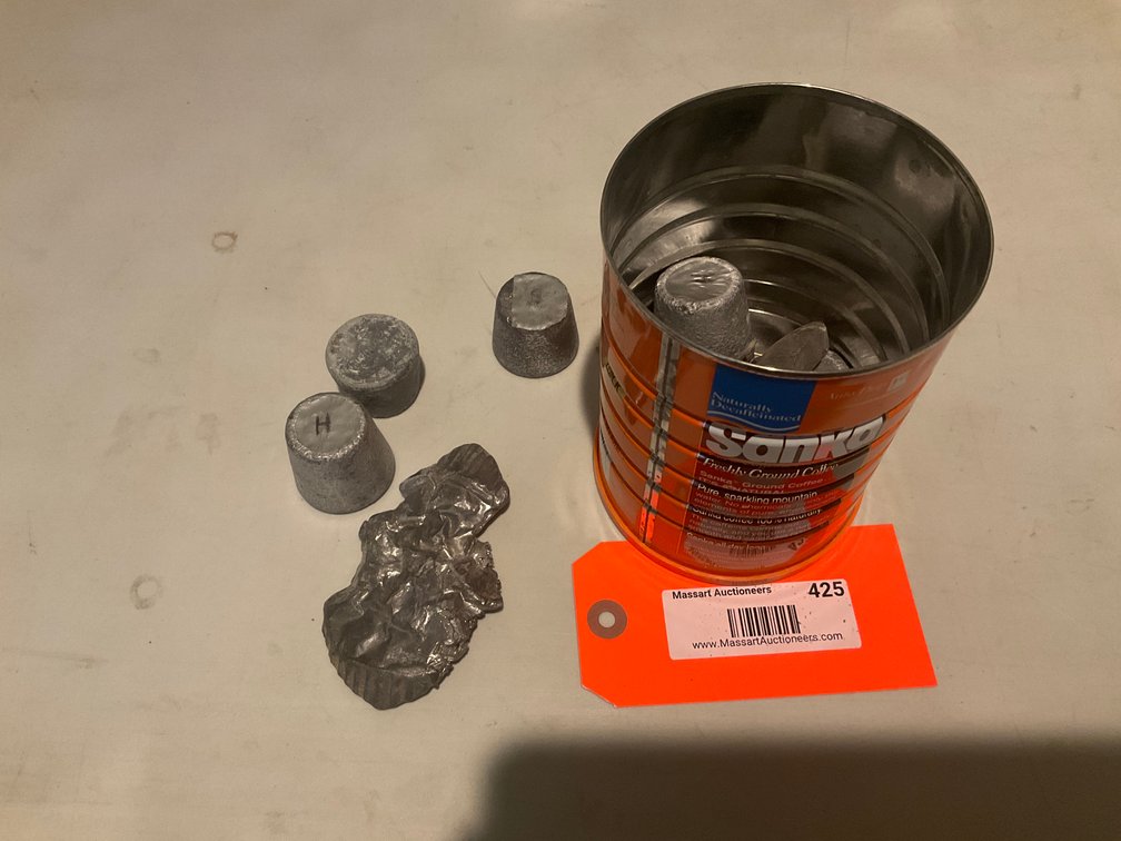 Cast metal ingots & scrap in coffee tin - Upstairs Bedrooms Upper Level