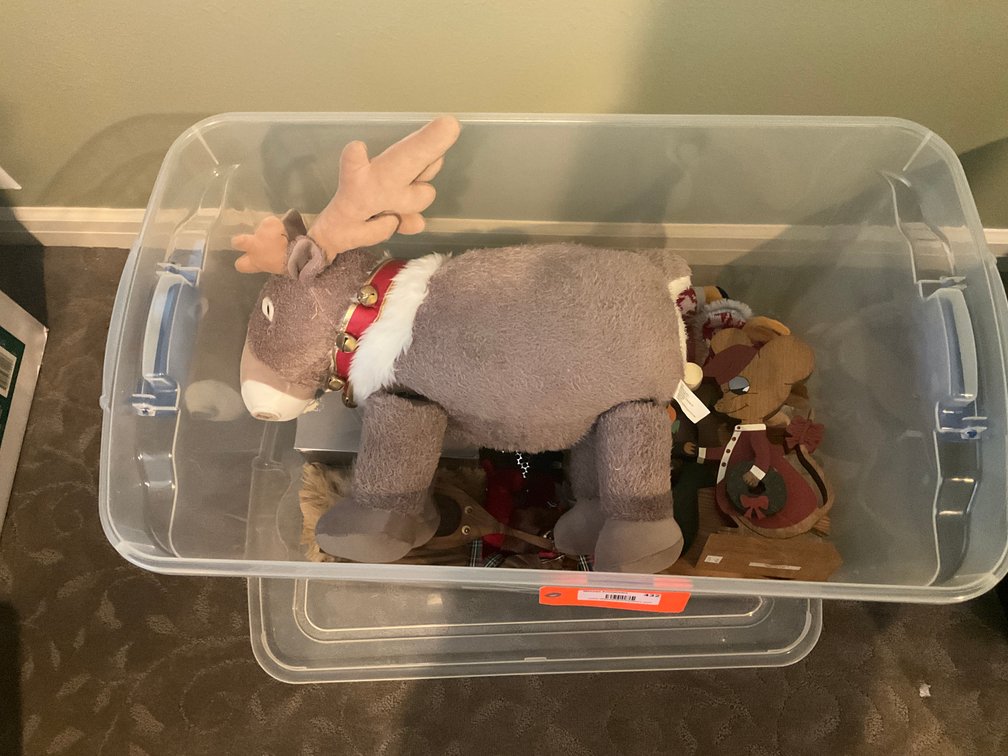 Christmas decor and plush figures in storage tote - Upstairs Bedrooms Upper Level