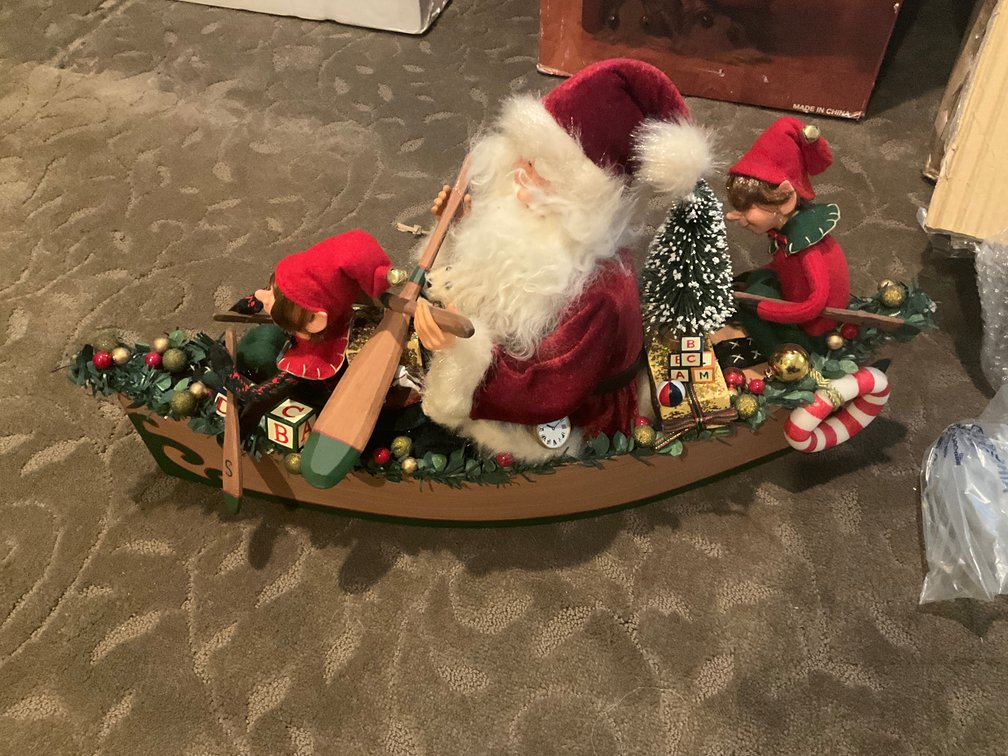 Santa Claus and elves in canoe holiday display figure - Upstairs Bedrooms Upper Level