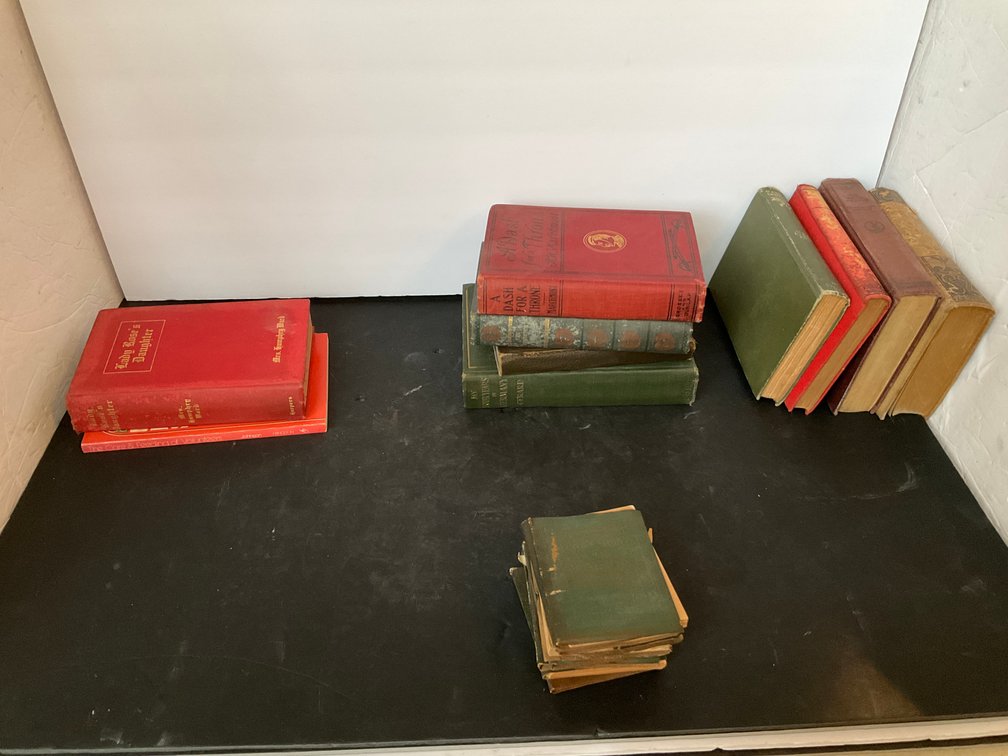 Grouping of hardcover clothbound books & booklets - Living Room Main Level