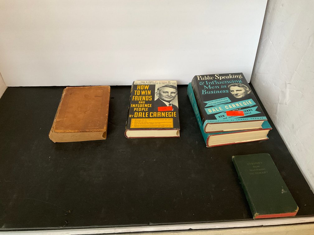 Grouping of books including Dale Carnegie - Living Room Main Level