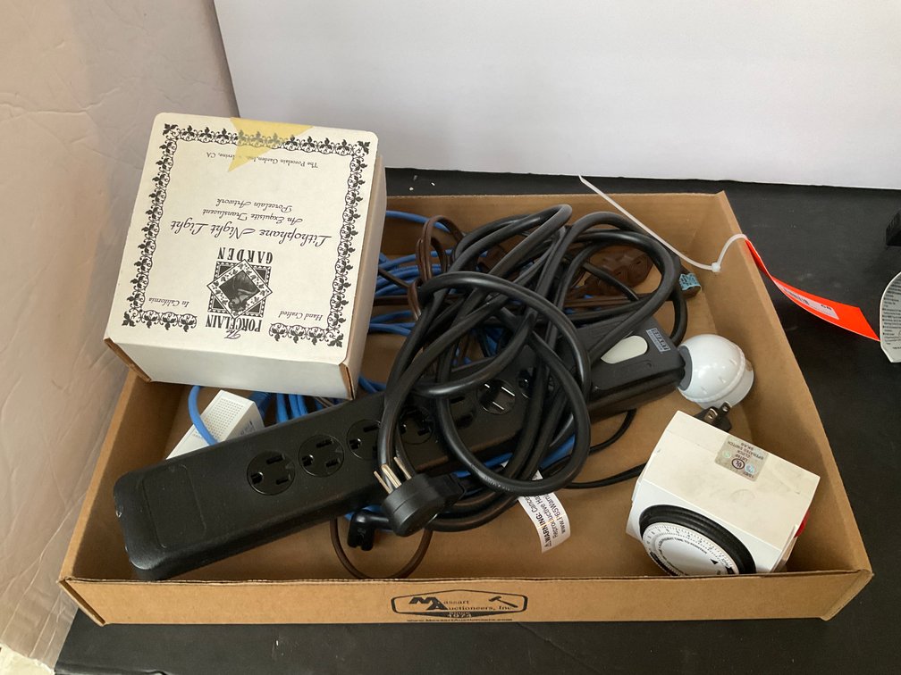 Assorted electrical accessories with 25 ft cord reel - Living Room Main Level