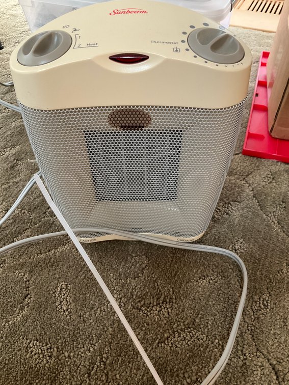 Sunbeam portable electric space heater - Living Room Main Level