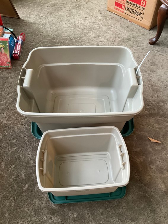 Tan plastic storage totes with dark green lids - Living Room Main Level