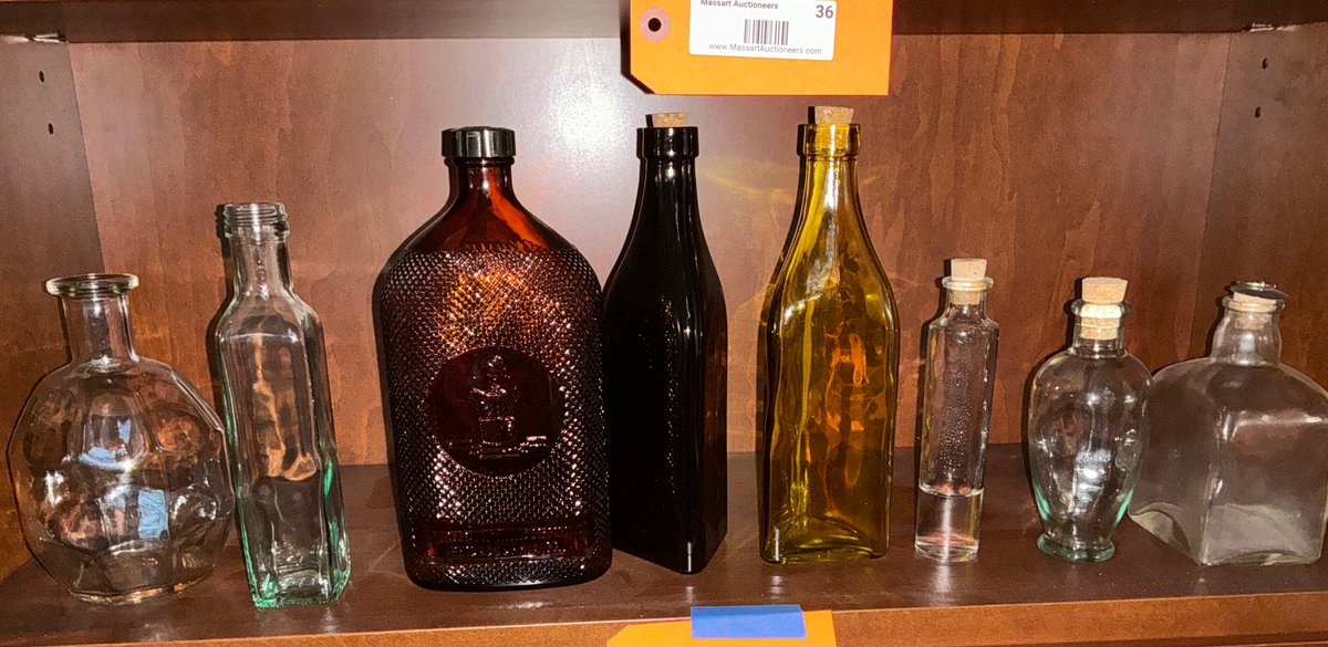 Grouping of glass bottles & decanters - Living Room Main Level