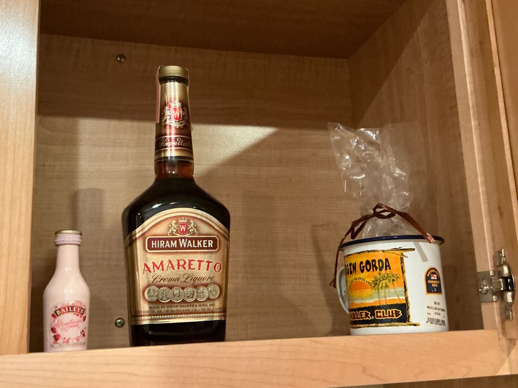 Assorted liquor bottles, shaker cup & enamel mug - must be 21 or older to purchase - Basement