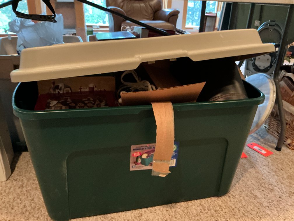 33-gallon storage tote with Christmas village buildings - Basement
