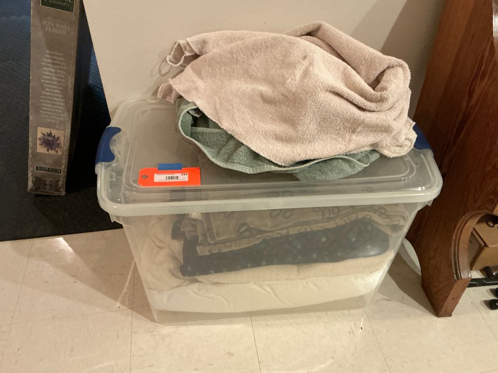 Storage tote with towels, linens & blankets - Basement