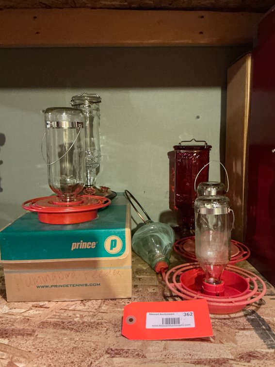 Grouping of glass hummingbird feeders - Basement