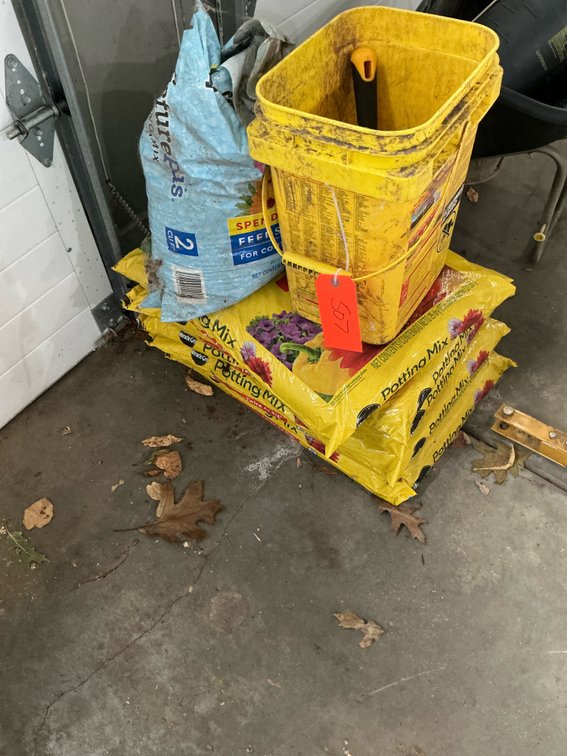Grouping of potting mix bags, bucket & hand trowel - Garage