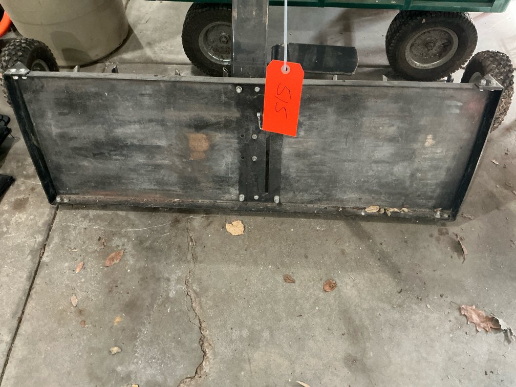 Tow-behind core aerator with weight tray - Garage
