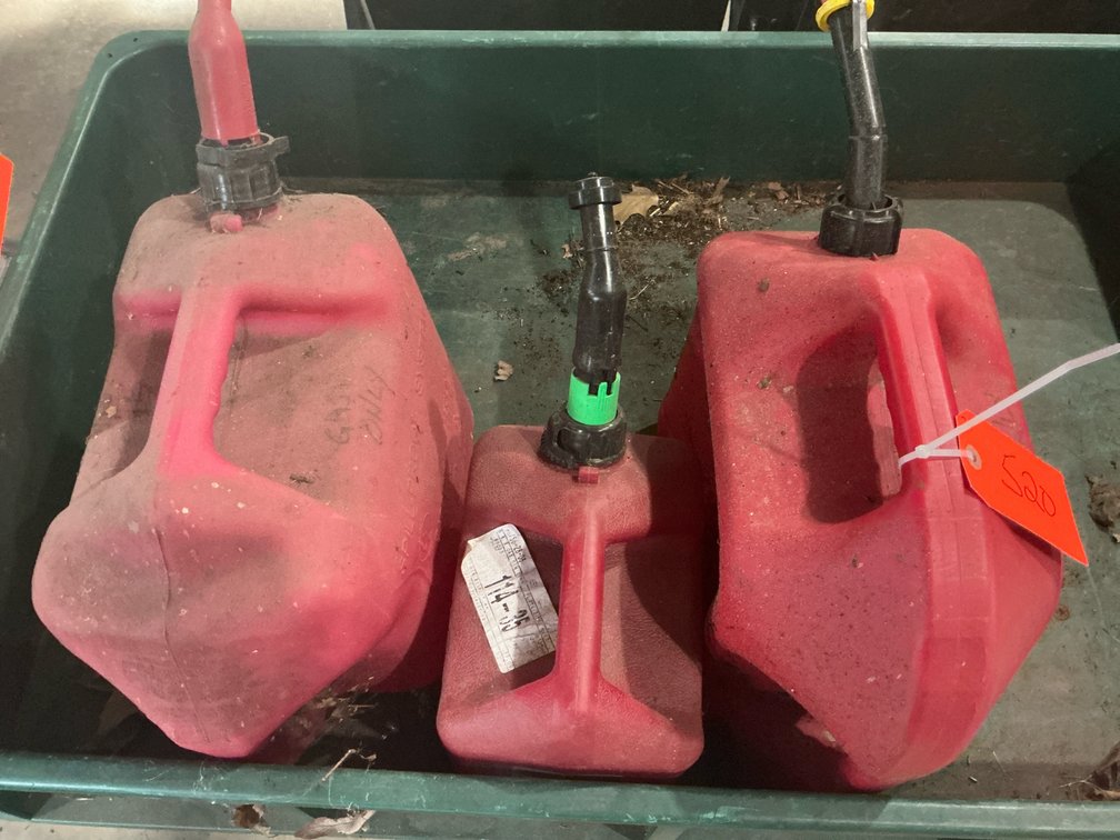 3 red plastic gas cans with spouts - Garage