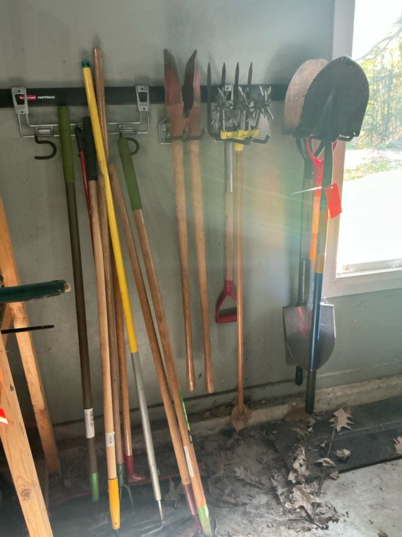 Grouping of long-handled lawn & garden tools - Garage
