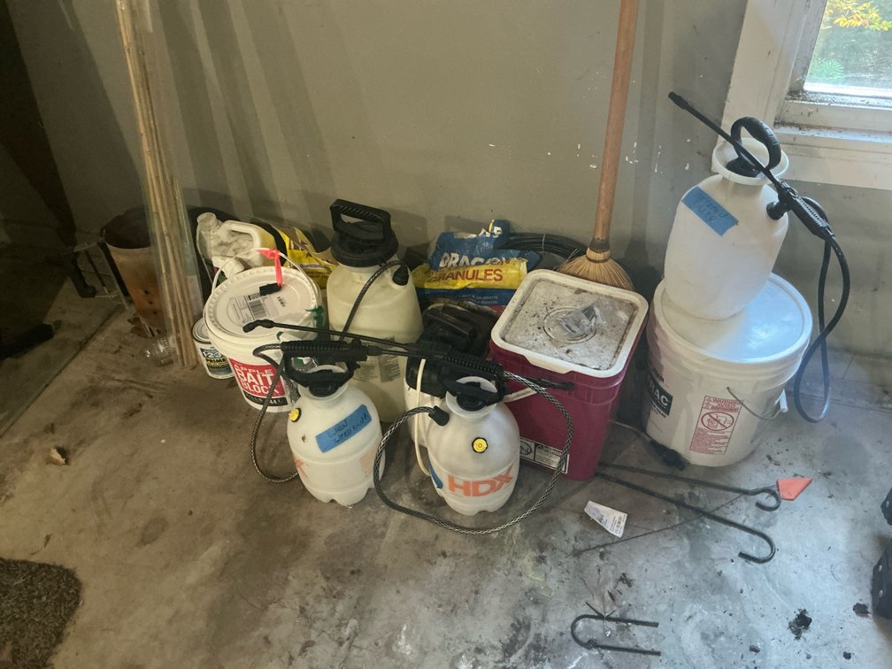 Lawn & garden supplies with pump sprayers & buckets - Garage