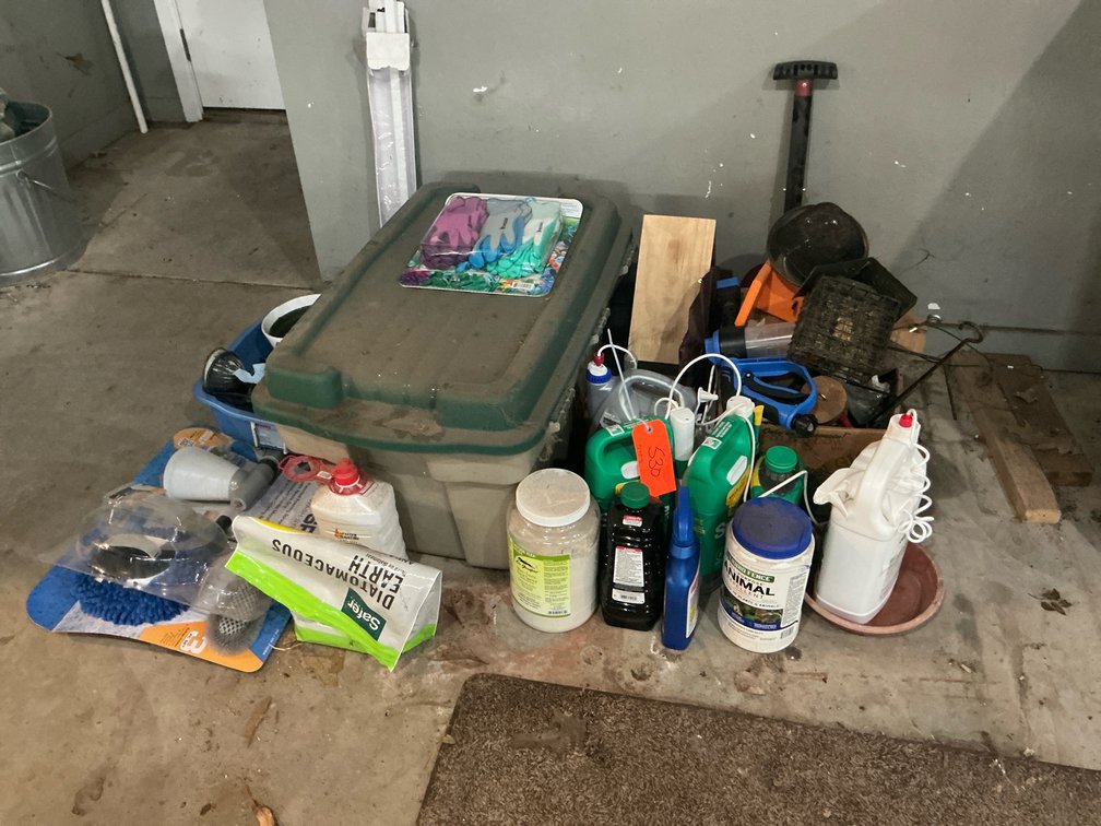Storage tote with lawn, garden & cleaning supplies - Garage