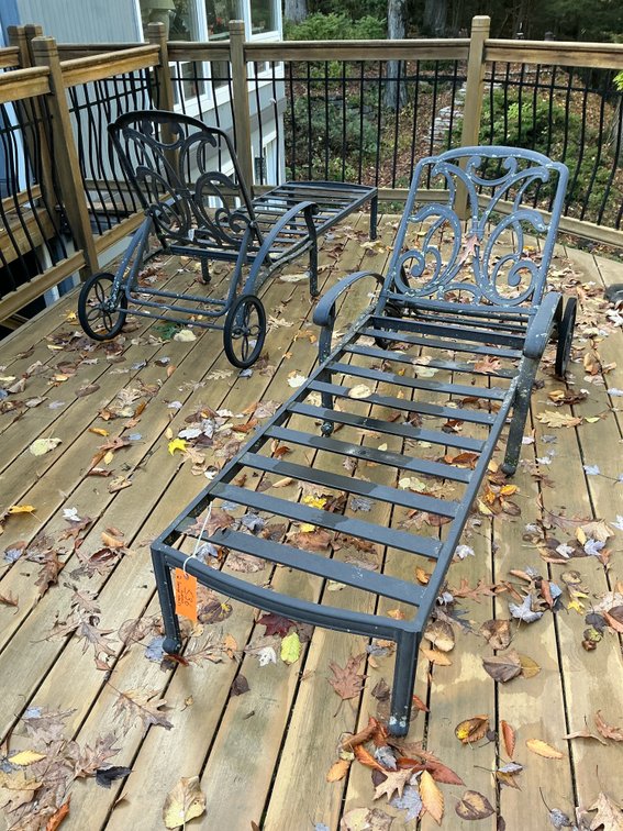 Pair of metal wheeled chaise lounges with cushions - Outside
