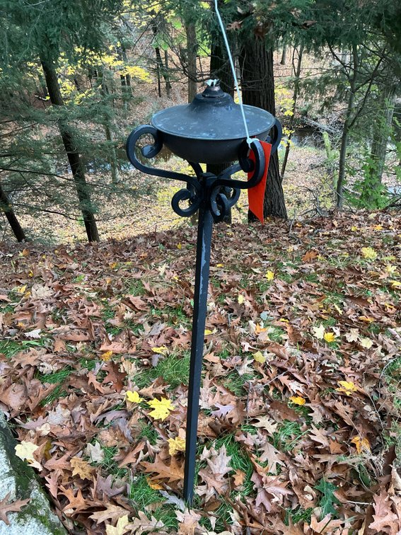 Black metal outdoor oil torch stakes with scroll bracket - Outside