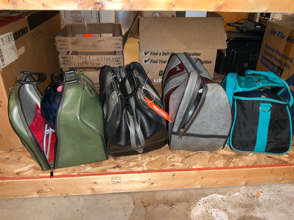 Grouping of 4 bowling balls with bags & shoes - Basement