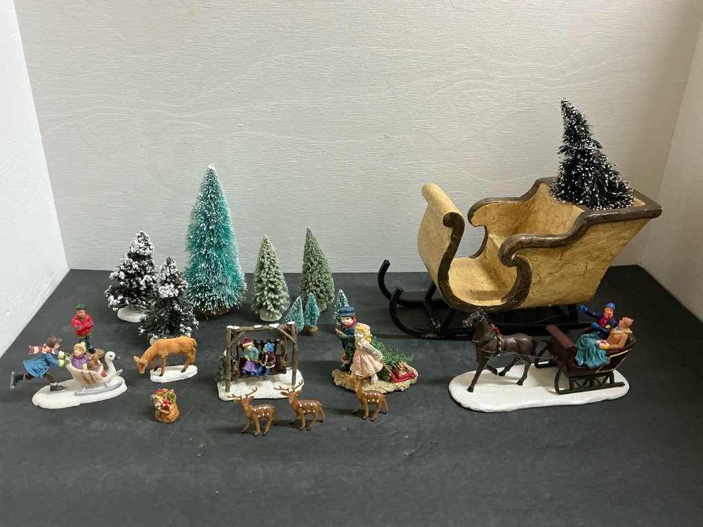 Holiday village figurines, sleighs & miniature trees