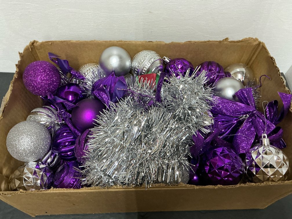 Assorted purple & silver holiday ornaments & garland