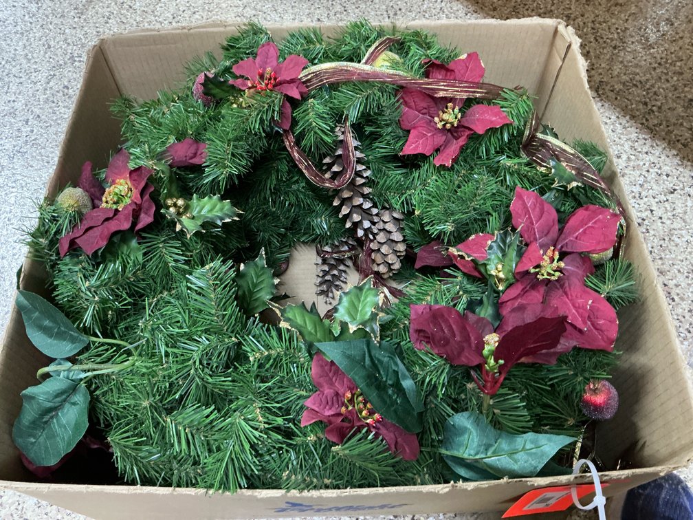 Artificial Christmas wreaths with poinsettias