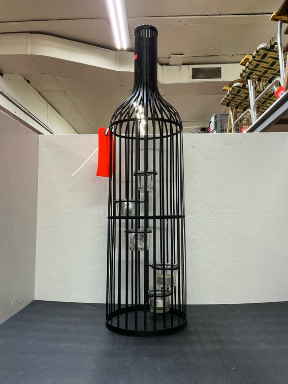 Black metal wine bottle-shaped candle holder