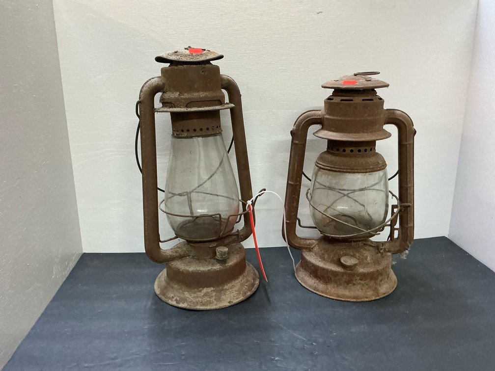 Pair of metal kerosene lanterns with glass globes