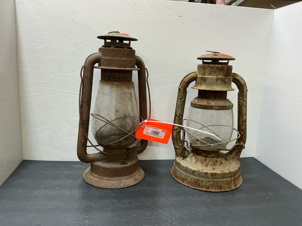 Pair of metal kerosene lanterns with glass globes
