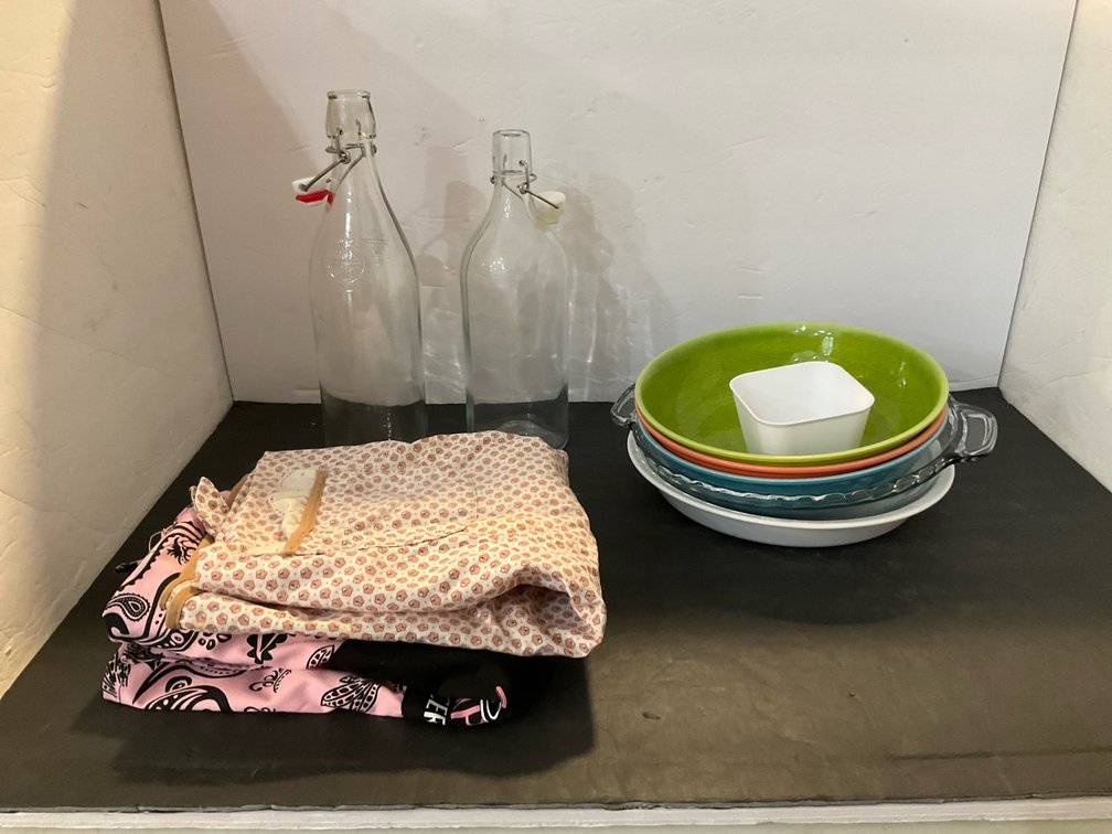 Kitchenware grouping with glass bottles, dishes & aprons - Kitchen