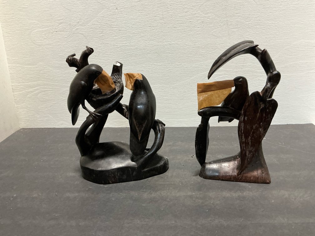 Pair of carved dark wood bird sculptures
