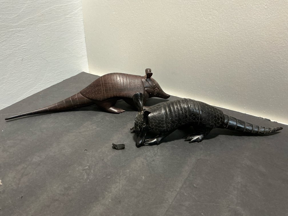 Pair of carved armadillo figurines